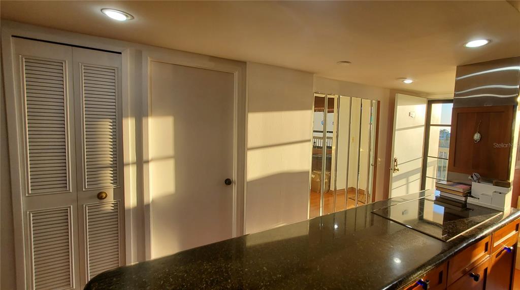 9415 Blind Pass Road, Unit 905 St. Pete Beach, FL 33706 - Photo 14 of 51 a view of a living room with a large window