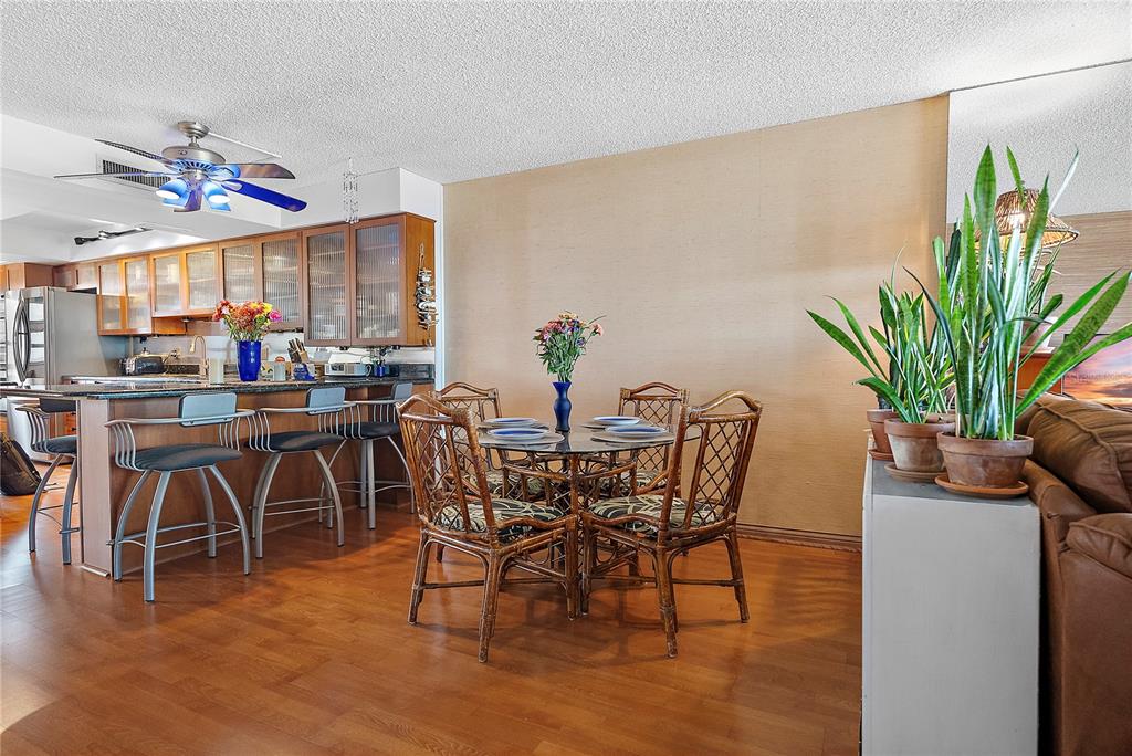 9415 Blind Pass Road, Unit 905 St. Pete Beach, FL 33706 - Photo 15 of 51 a view of a dining room with furniture window and outside view