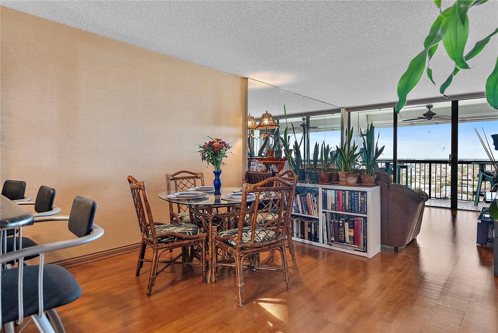 9415 Blind Pass Road, Unit 905 St. Pete Beach, FL 33706 - Photo 16 of 51 a view of a dining room with furniture window and outside view