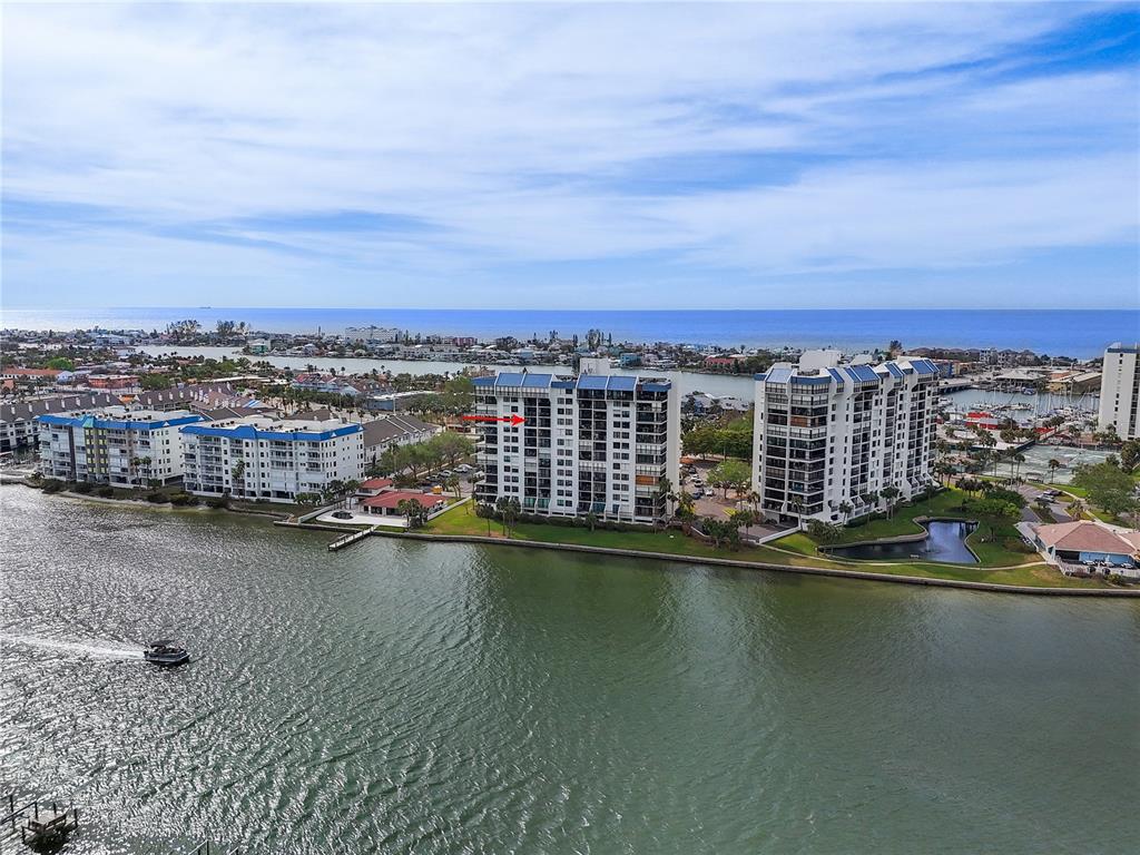 9415 Blind Pass Road, Unit 905 St. Pete Beach, FL 33706 - Photo 2 of 51 an aerial view of a city with lake view