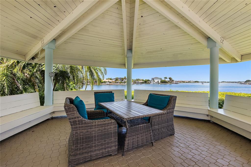 9415 Blind Pass Road, Unit 905 St. Pete Beach, FL 33706 - Photo 28 of 51 a view of outdoor space with seating space