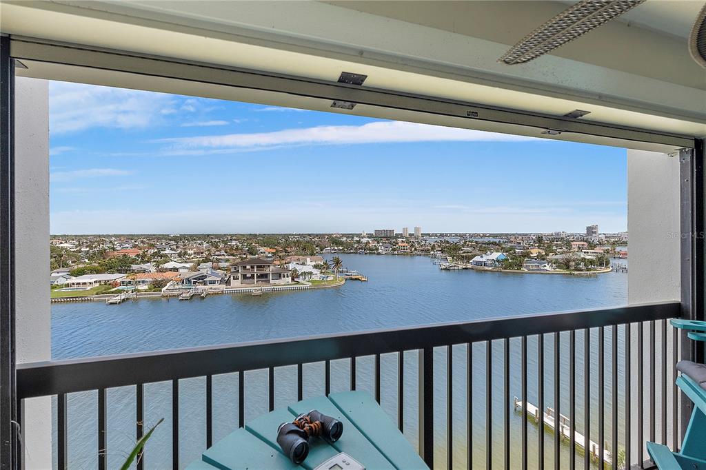 9415 Blind Pass Road, Unit 905 St. Pete Beach, FL 33706 - Photo 30 of 51 a view of a balcony with an ocean view