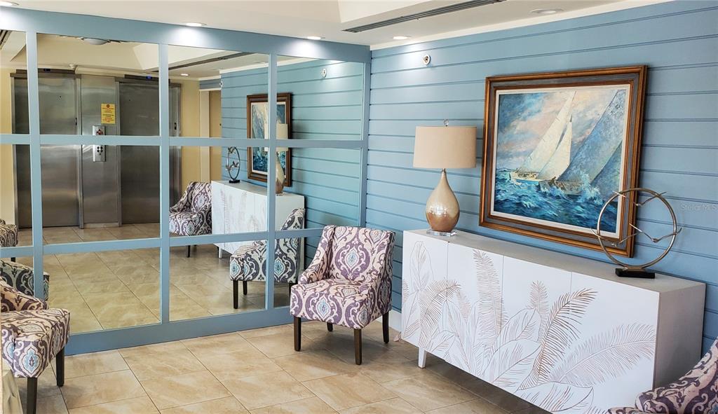 9415 Blind Pass Road, Unit 905 St. Pete Beach, FL 33706 - Photo 40 of 51 a living room with furniture and a window