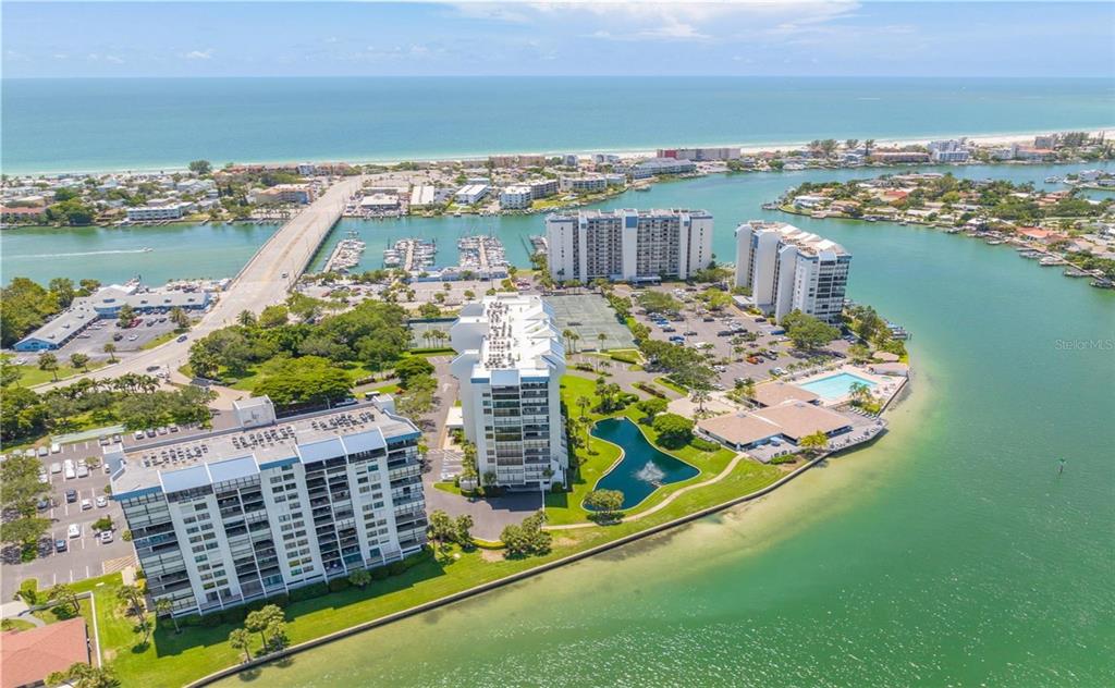 9415 Blind Pass Road, Unit 905 St. Pete Beach, FL 33706 - Photo 7 of 51 a view of a city with an ocean view
