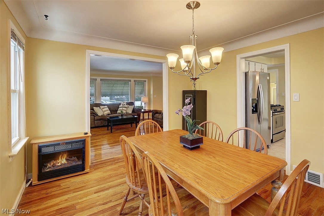 4457 Groveland Road University Heights, OH 44118 - Photo 7 of 24 The dining room adjoins the living room and also has warm wood floors, cove moldings. Perfect for entertaining.