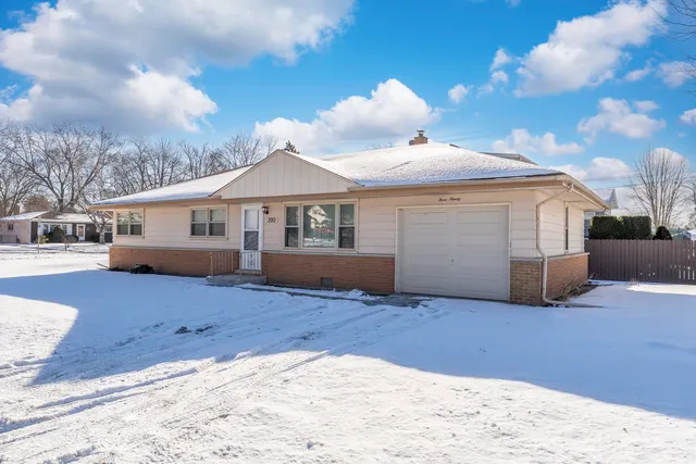 a view of a house with a snow in the yard