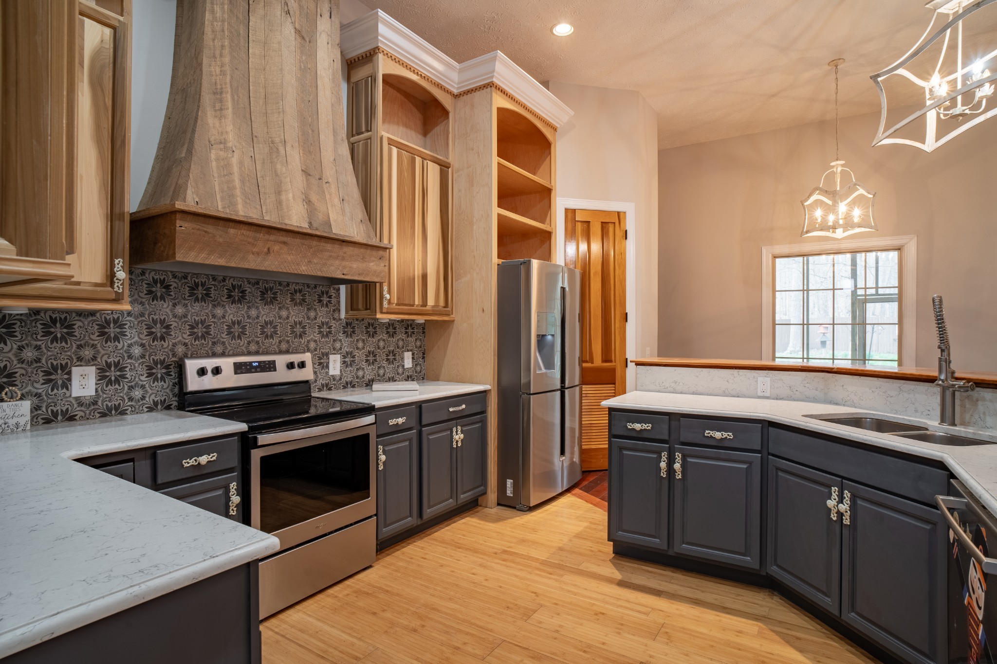550 Laurel Crown Road Manchester, TN 37355 - Photo 65 of 87 a kitchen with stainless steel appliances granite countertop a sink stove and refrigerator