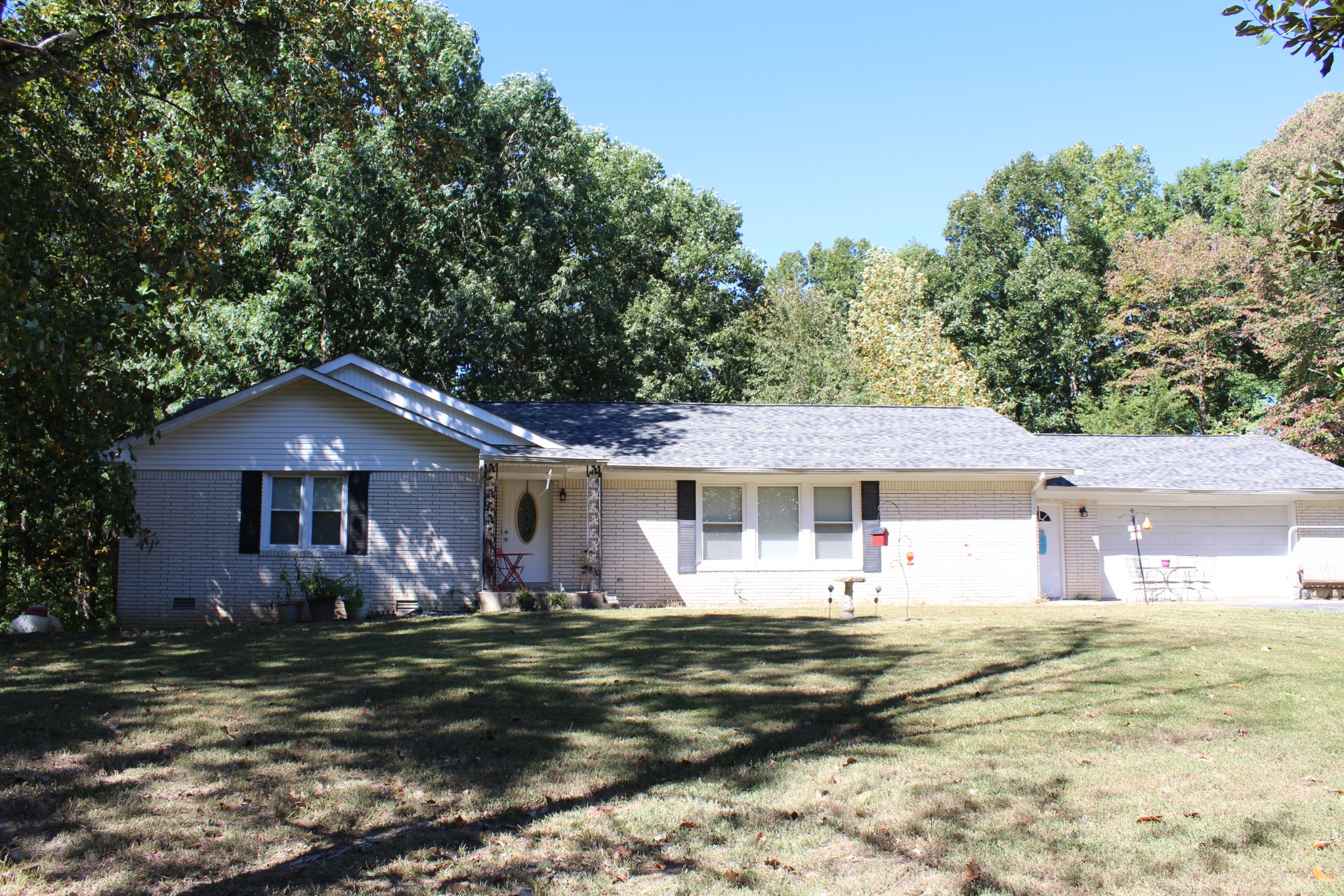 115 Day Lane Tennessee Ridge, TN 37178 - Photo 1 of 22 a front view of a house with a garden