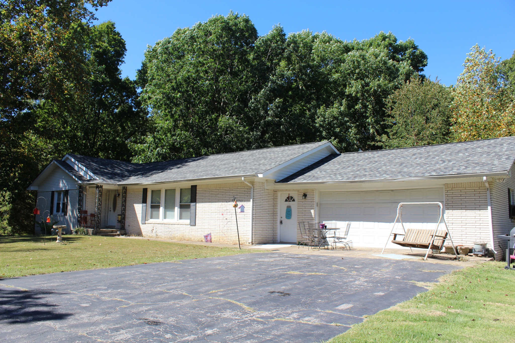115 Day Lane Tennessee Ridge, TN 37178 - Photo 3 of 22 a front view of a house with a yard and garage