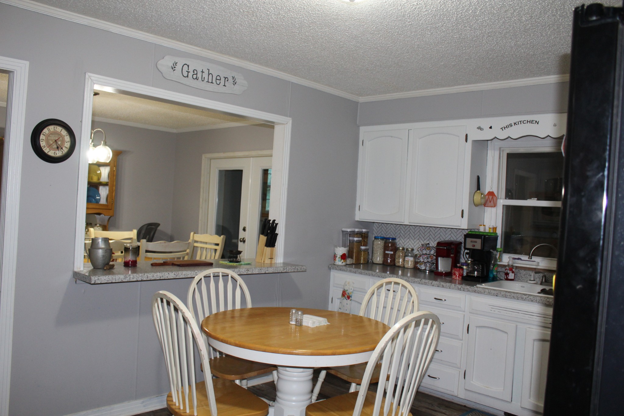 115 Day Lane Tennessee Ridge, TN 37178 - Photo 5 of 22 a kitchen with a table chairs and a refrigerator