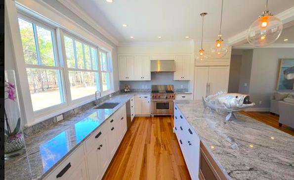 25 Meshacket Road Edgartown, MA 02539 - Photo 9 of 27 a large kitchen with kitchen island granite countertop lots of counter space and stainless steel appliances