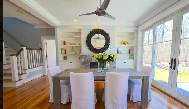 25 Meshacket Road Edgartown, MA 02539 - Photo 11 of 27 a living room with furniture a large window and wooden floor