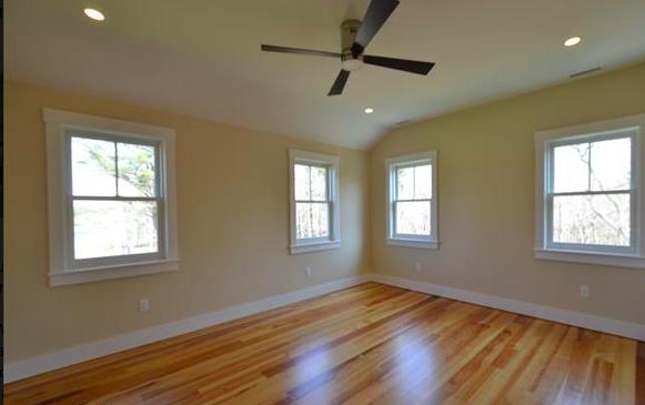 25 Meshacket Road Edgartown, MA 02539 - Photo 14 of 27 a view of an empty room with wooden floor and a window