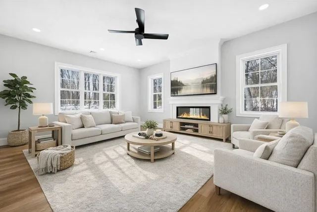 a living room with furniture and a fireplace