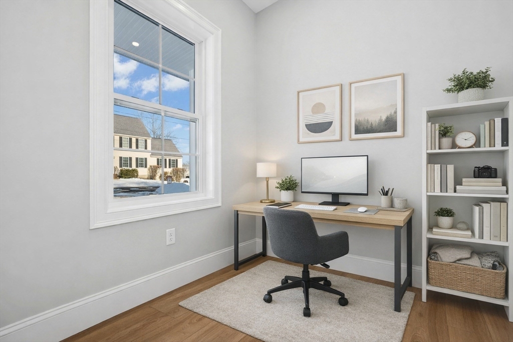 2 B Wilson Road, Unit B Millbury, MA 01527 - Photo 18 of 40 a view of a workspace with furniture and a window