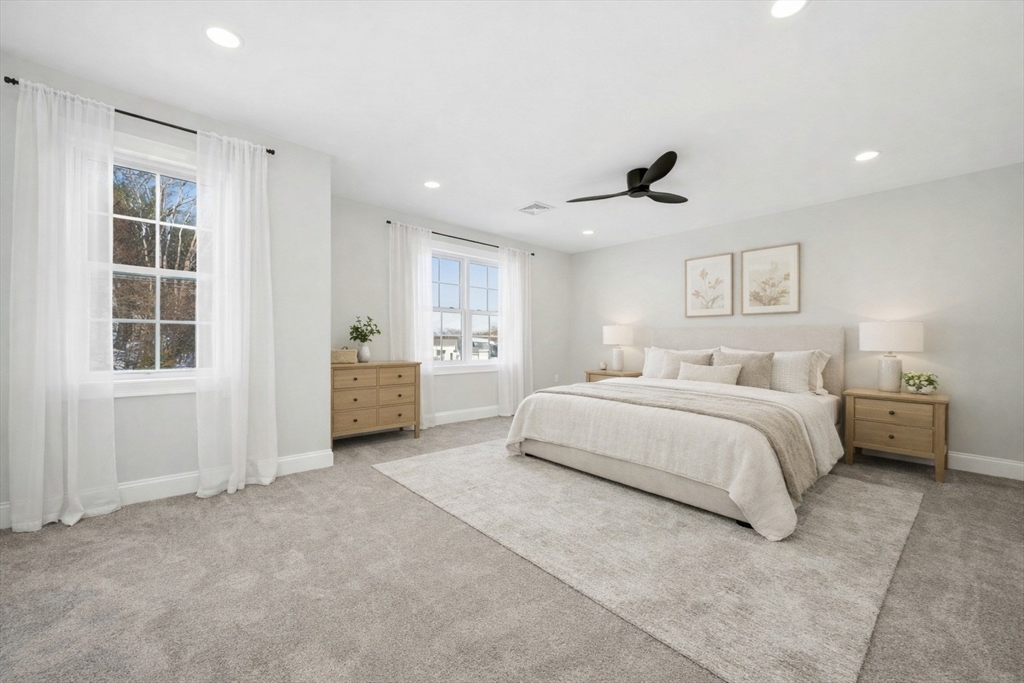 2 B Wilson Road, Unit B Millbury, MA 01527 - Photo 21 of 40 a spacious bedroom with a bed and a window