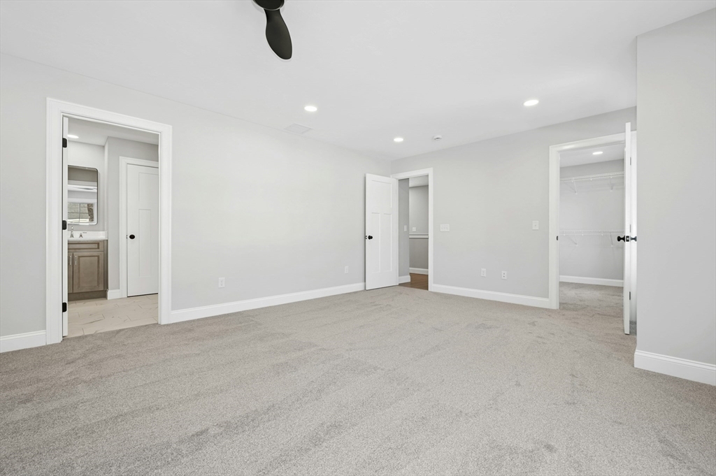 2 B Wilson Road, Unit B Millbury, MA 01527 - Photo 24 of 40 an empty room with fan and windows