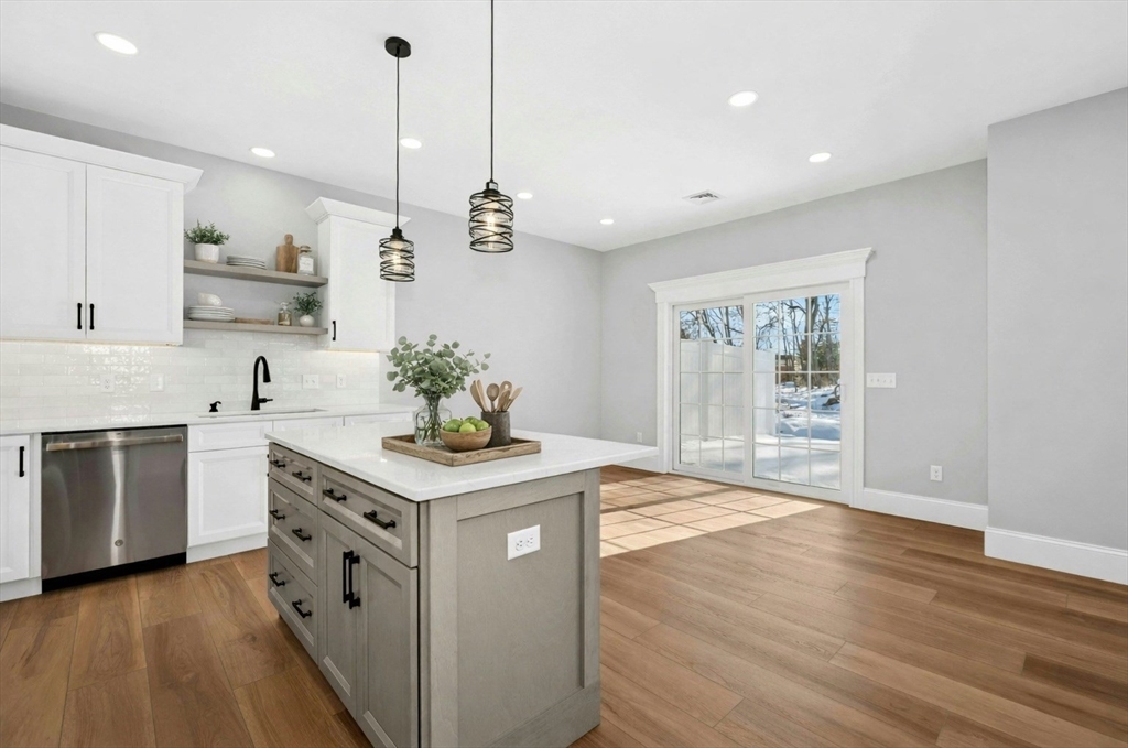 2 B Wilson Road, Unit B Millbury, MA 01527 - Photo 6 of 40 a kitchen with stainless steel appliances granite countertop a stove a sink and a refrigerator
