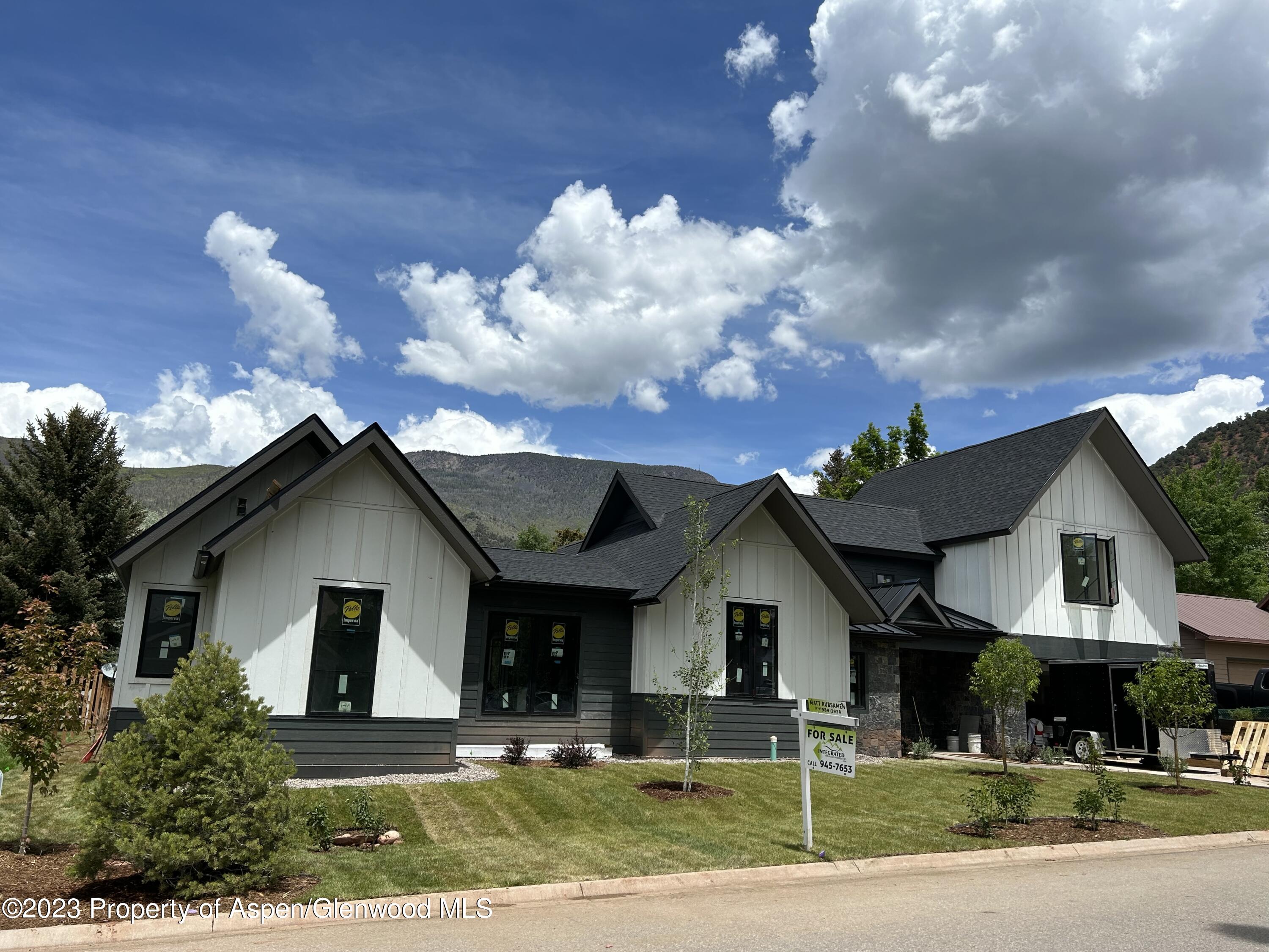 1014 Lauren Lane Basalt, CO 81621 - Photo 1 of 7 a front view of a house with a yard