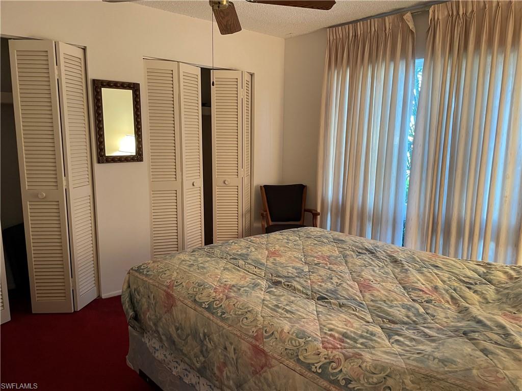 126 Teryl Road, Unit 3 Naples, FL 34112 - Photo 13 of 13 Guest bedroom with plenty of closet storage.