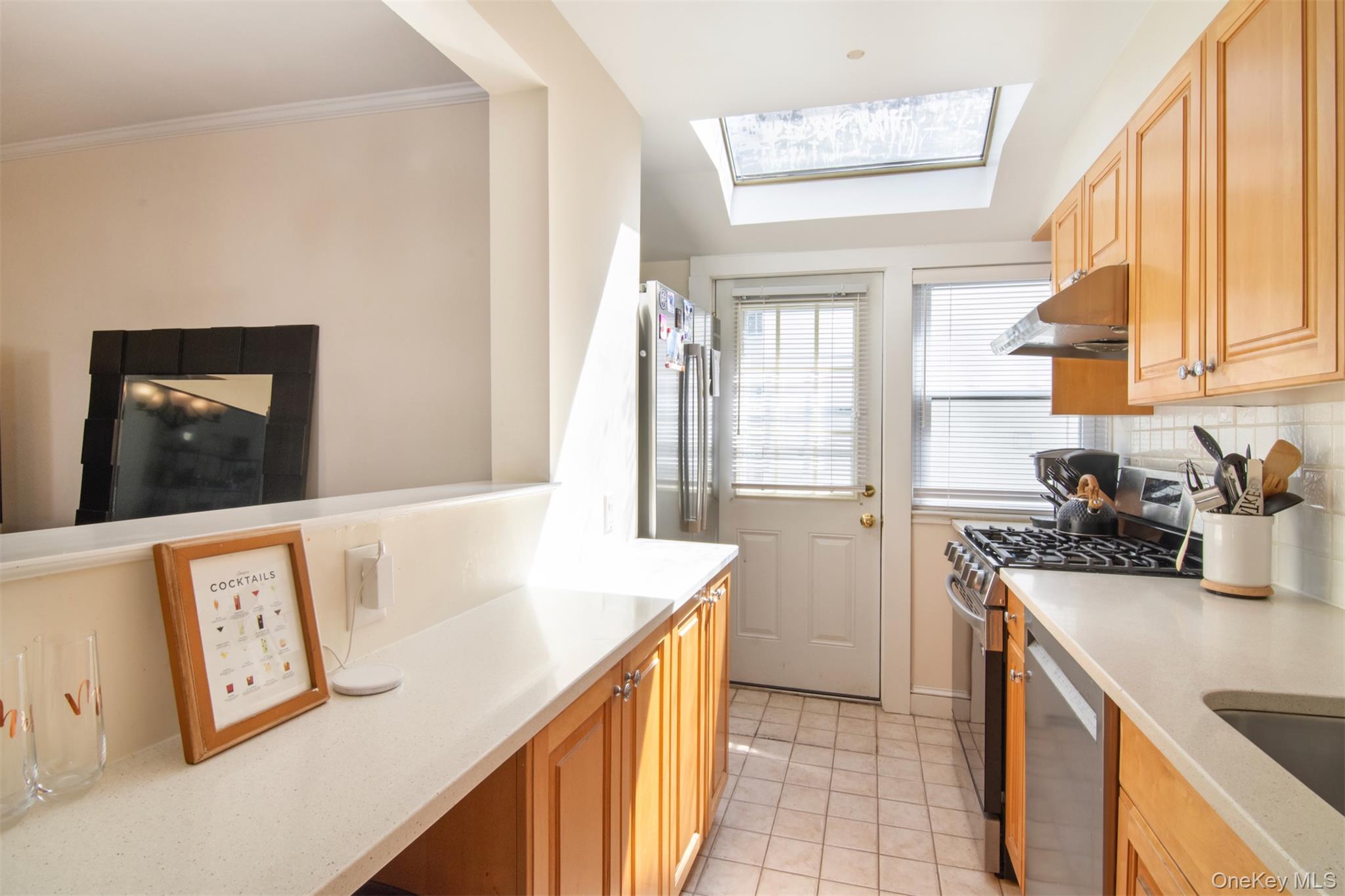 74 Kensington Road Bronxville, NY 10708 - Photo 15 of 33 a kitchen with a sink a stove and cabinets