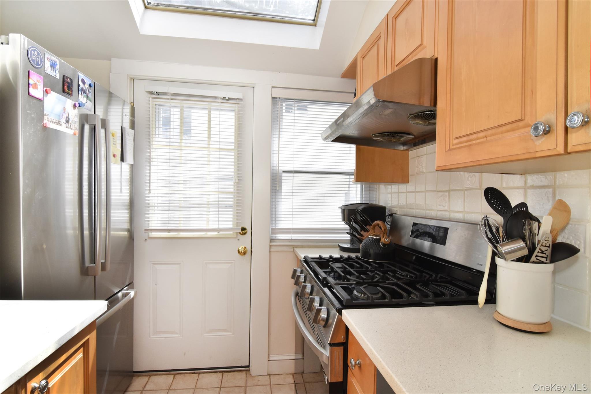 74 Kensington Road Bronxville, NY 10708 - Photo 16 of 33 a kitchen with a stove and a cabinet