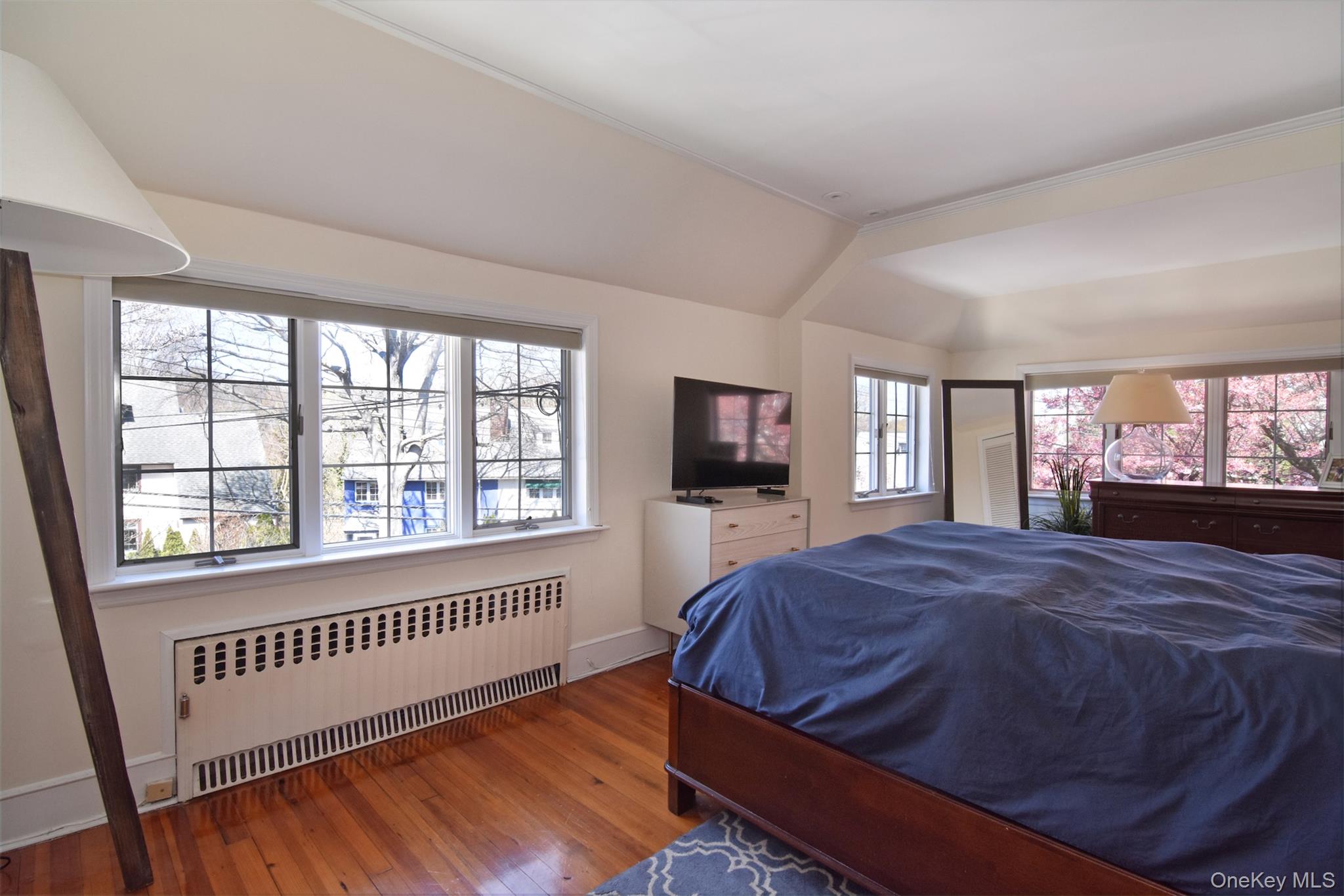 74 Kensington Road Bronxville, NY 10708 - Photo 18 of 33 a bedroom with a bed and a tv on next to a window