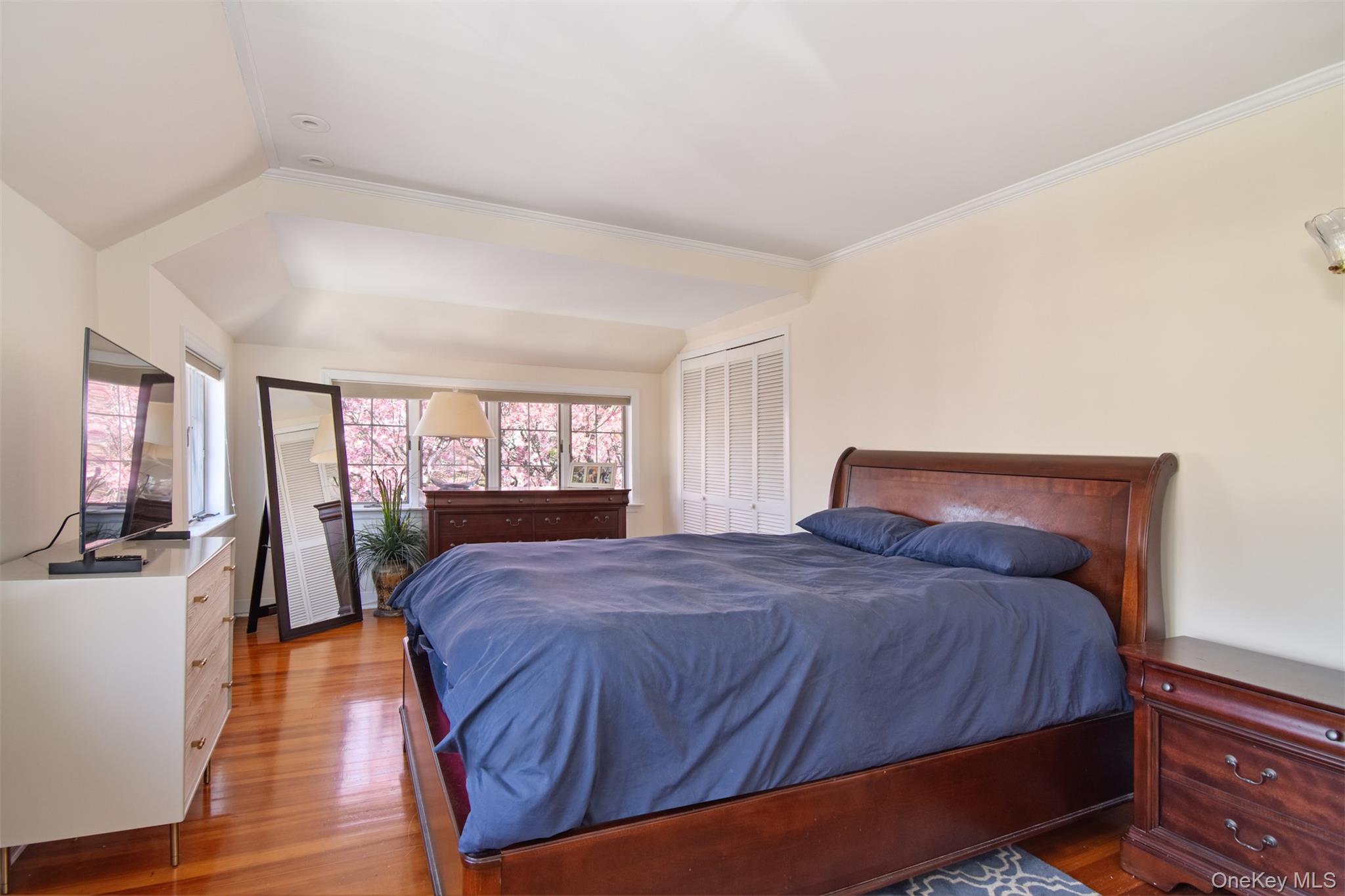 74 Kensington Road Bronxville, NY 10708 - Photo 19 of 33 a large bed sitting in a bedroom next to a window