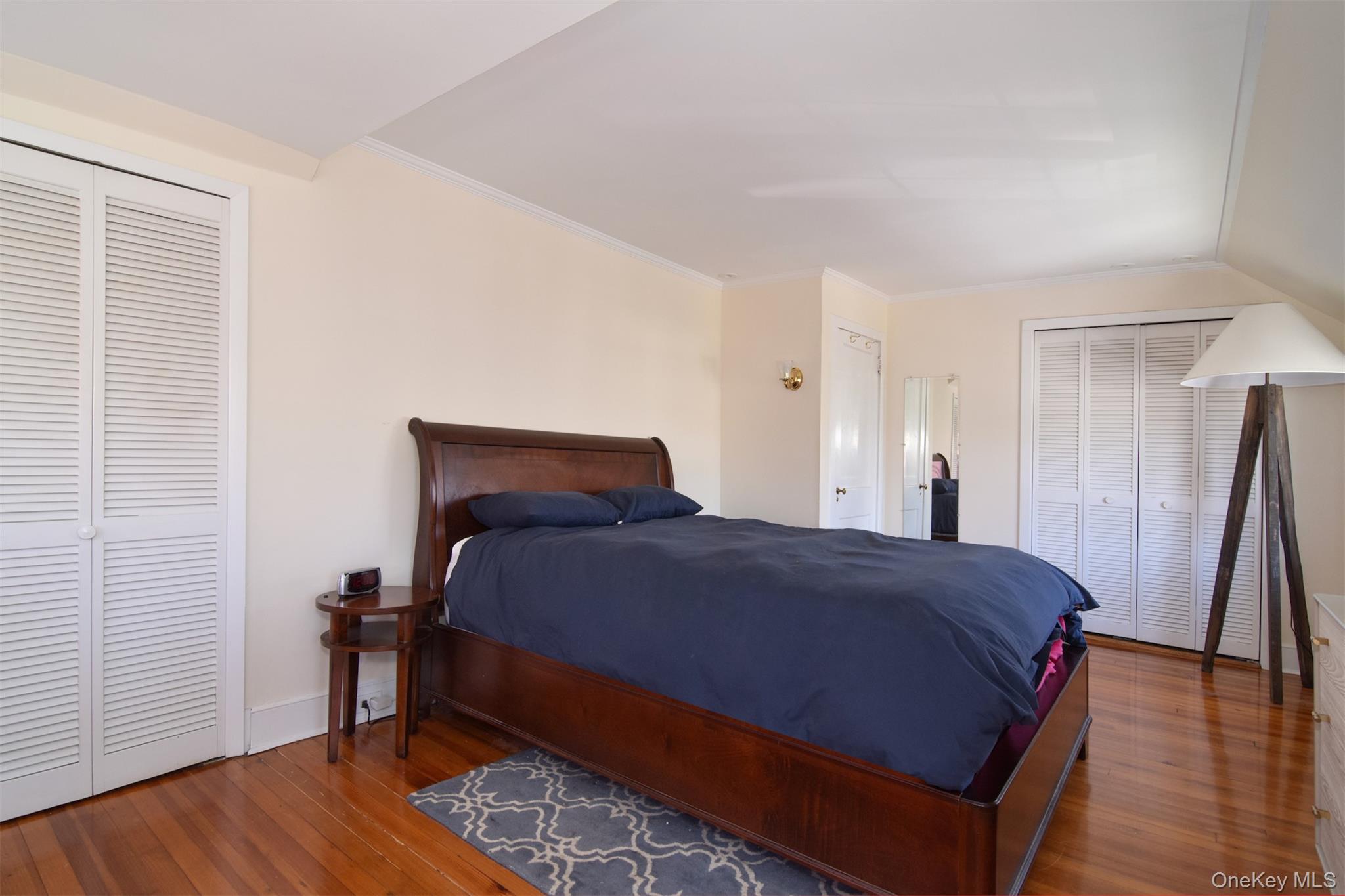 74 Kensington Road Bronxville, NY 10708 - Photo 20 of 33 a bedroom with a bed and wooden floor