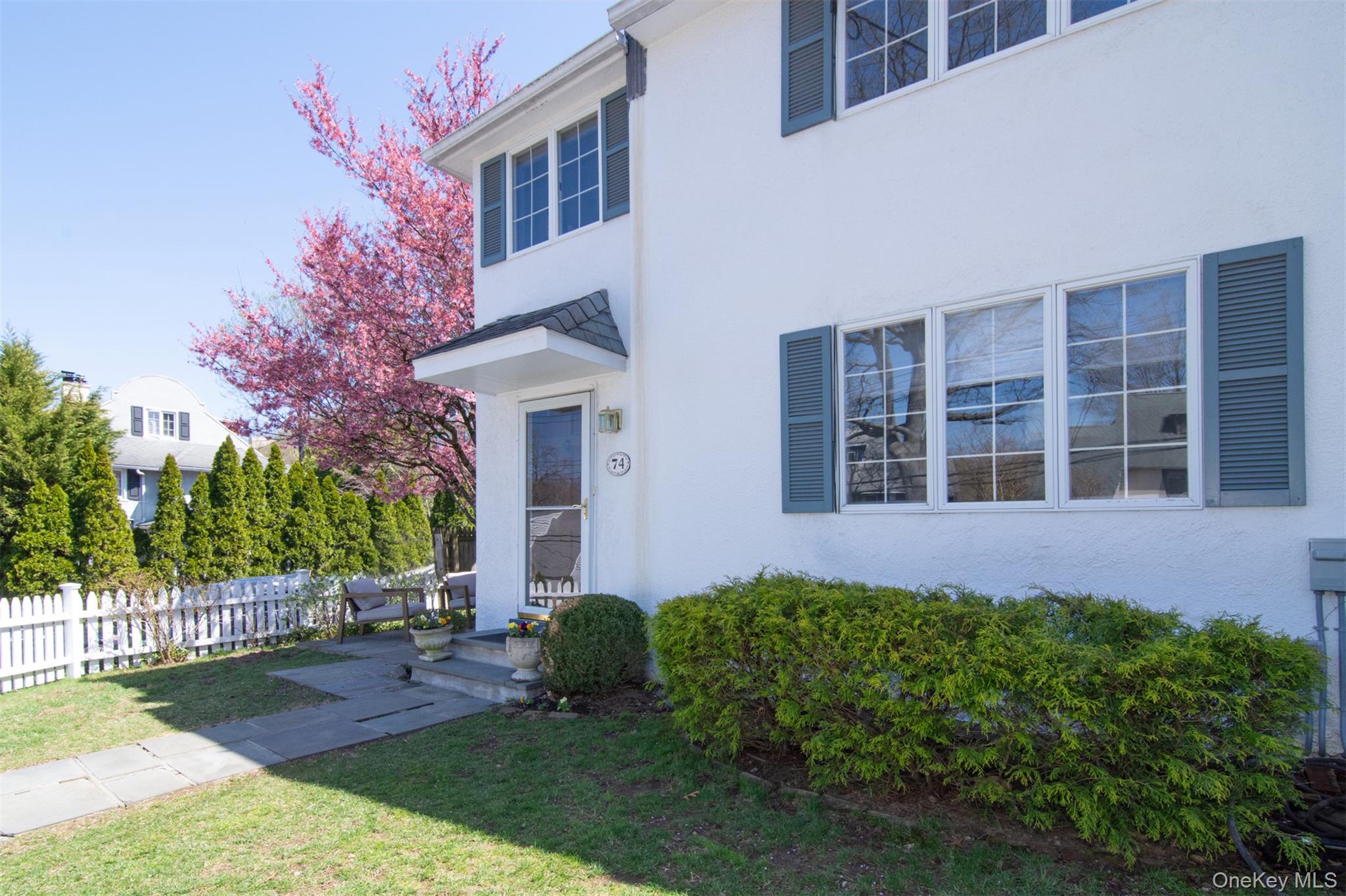 74 Kensington Road Bronxville, NY 10708 - Photo 4 of 33 a house view with a garden space