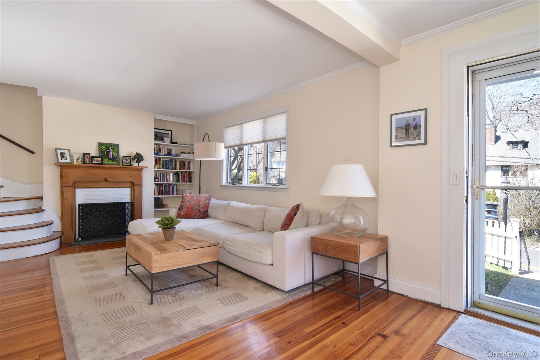 74 Kensington Road Bronxville, NY 10708 - Photo 6 of 33 a living room with furniture a fireplace and a window