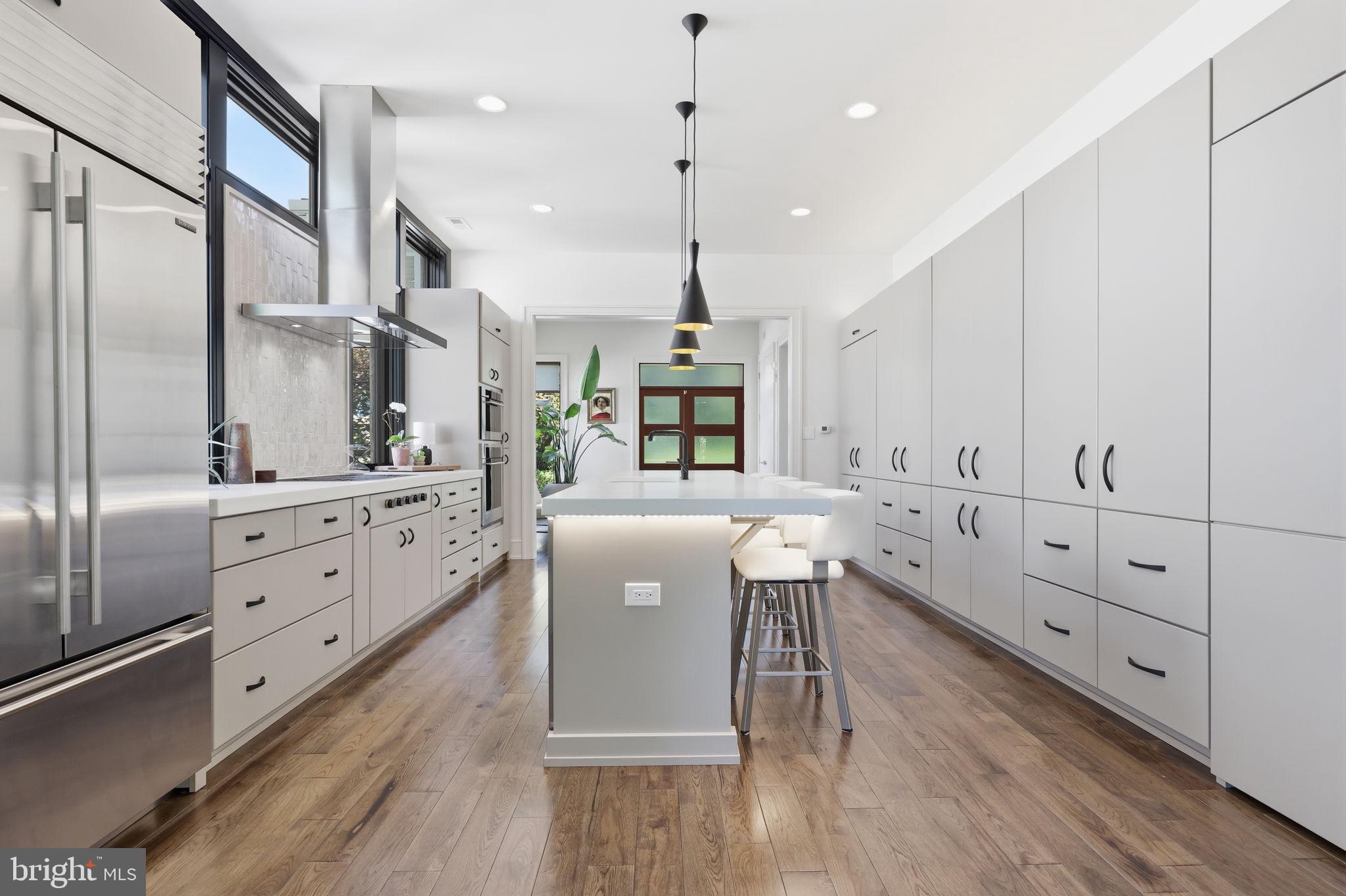 94 East Street Doylestown, PA 18901 - Photo 23 of 65 a kitchen with kitchen island white cabinets and stainless steel appliances