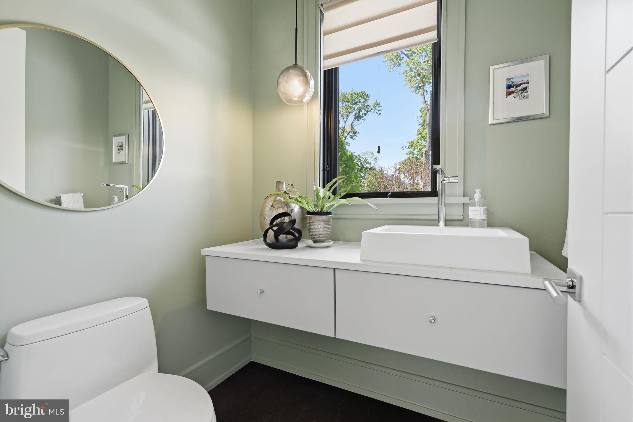 94 East Street Doylestown, PA 18901 - Photo 27 of 65 a bathroom with a toilet a sink and a mirror