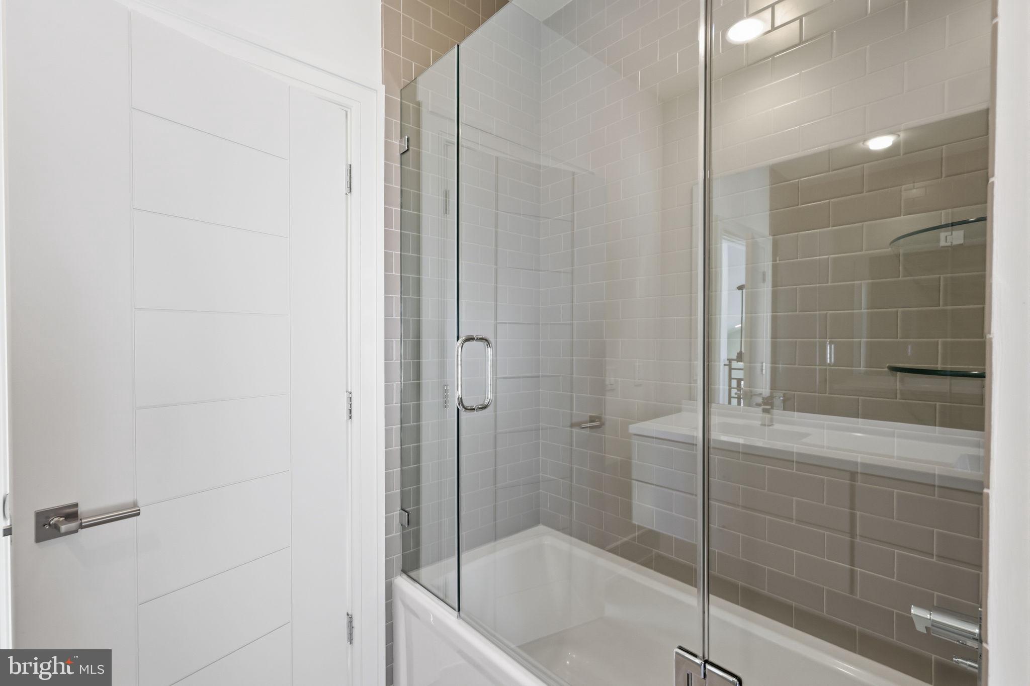 94 East Street Doylestown, PA 18901 - Photo 47 of 65 a bathroom with a shower and a bath tub