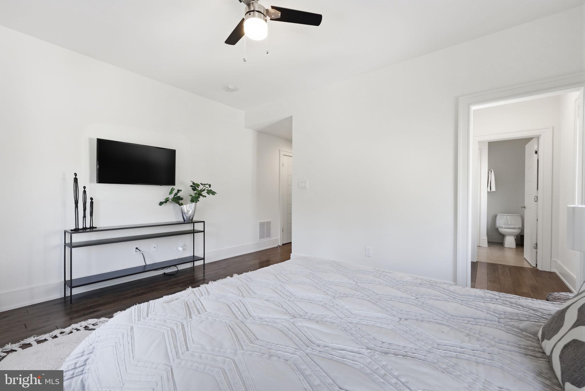 94 East Street Doylestown, PA 18901 - Photo 50 of 65 a bedroom with a bed and a flat screen tv