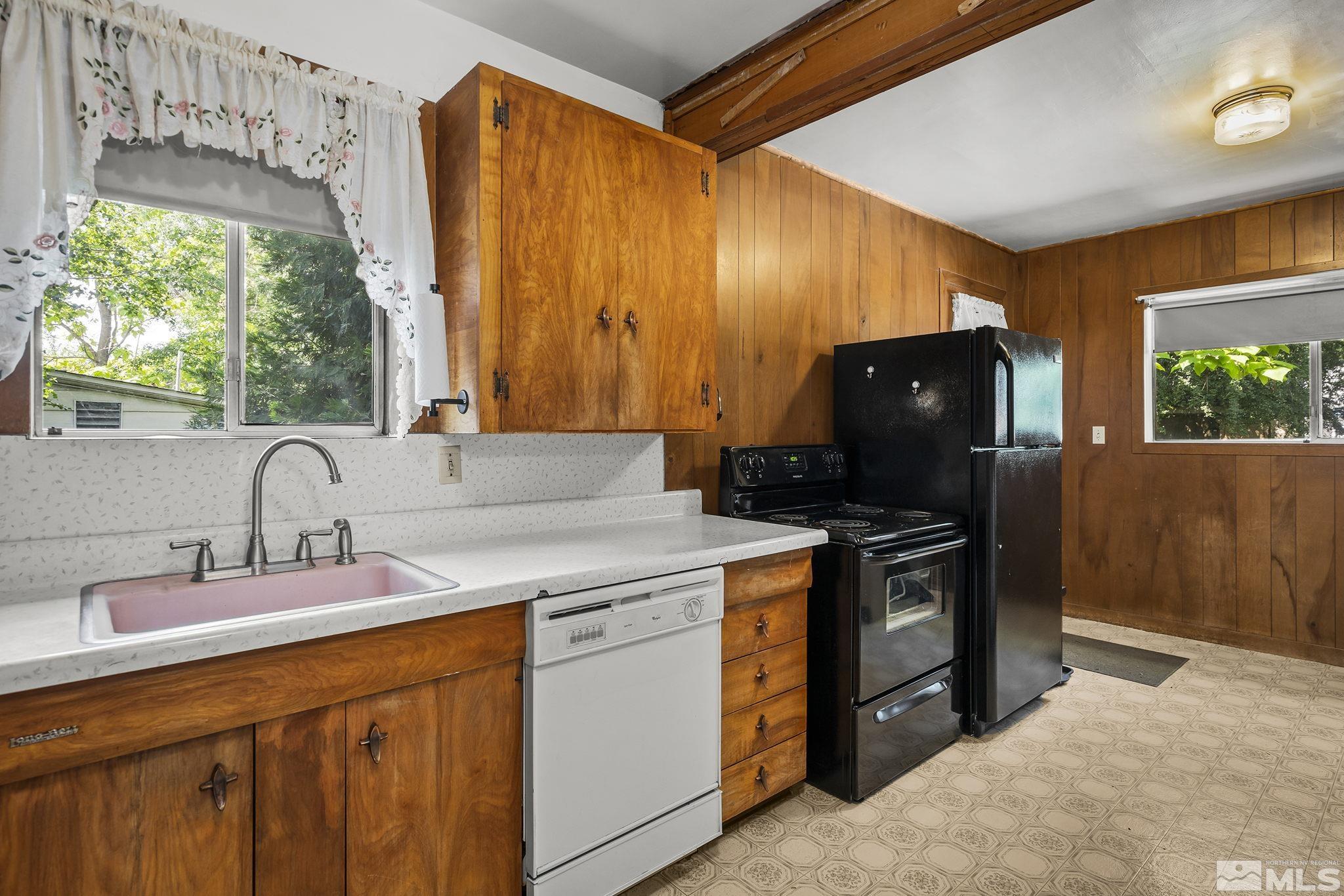 1015 Forest Street Reno, NV 89509 - Photo 11 of 22 a kitchen with a stove and a sink
