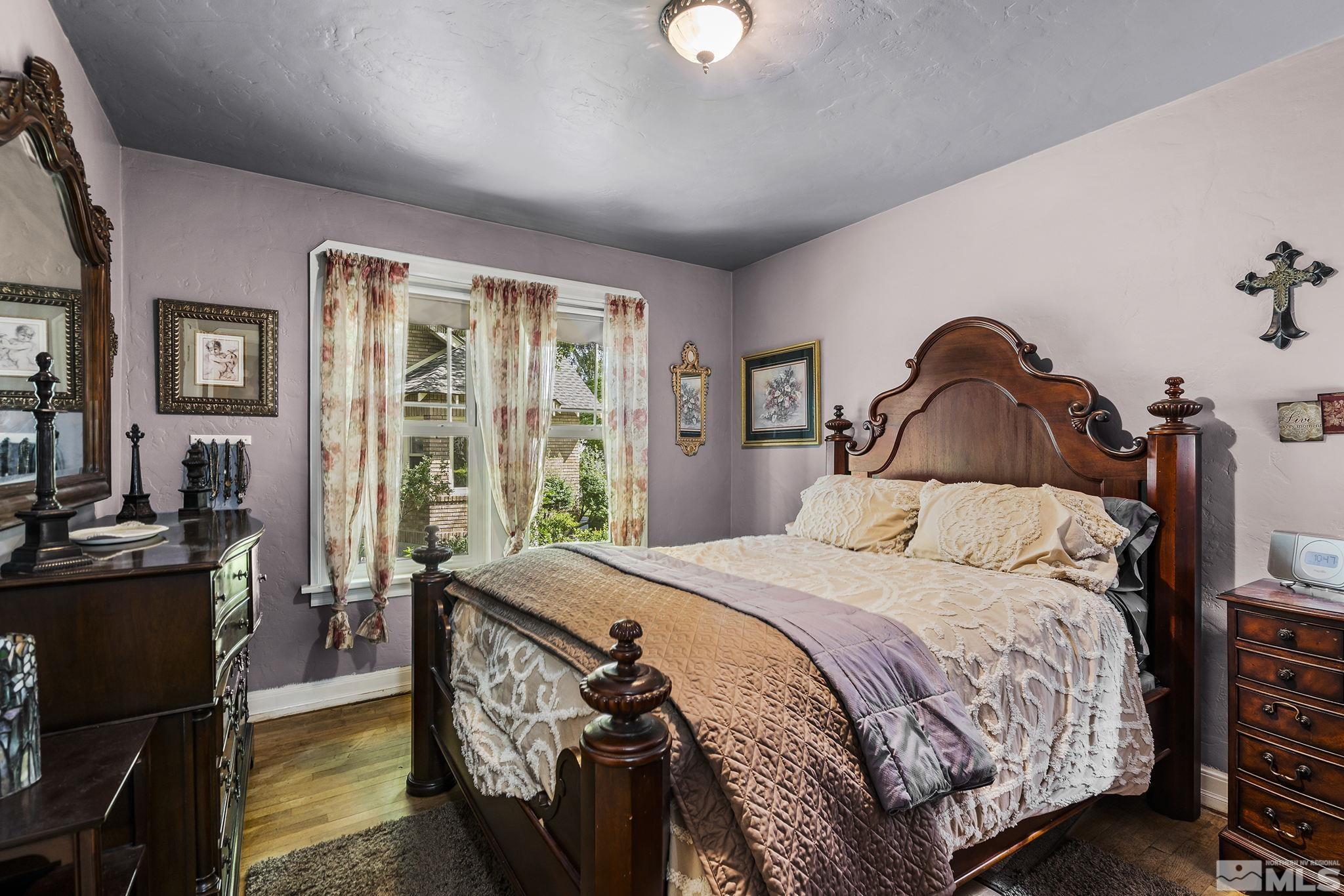 1015 Forest Street Reno, NV 89509 - Photo 12 of 22 a bedroom with a bed and wooden floor