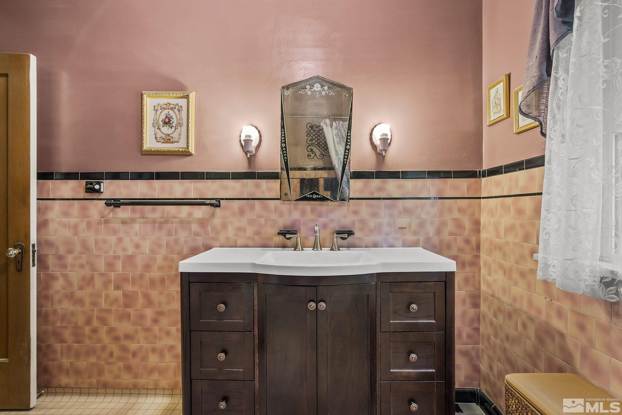 1015 Forest Street Reno, NV 89509 - Photo 14 of 22 a bathroom with a sink and a mirror