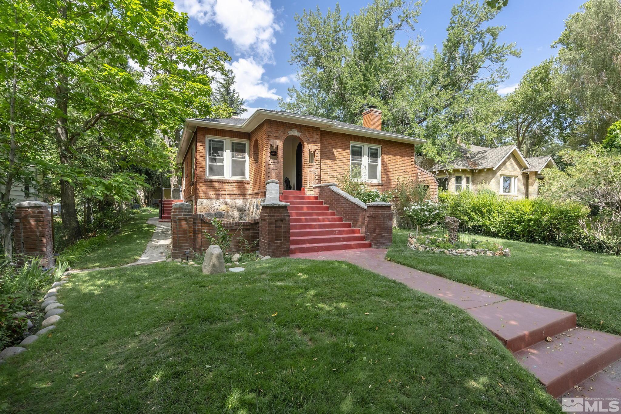 1015 Forest Street Reno, NV 89509 - Photo 2 of 22 a front view of a house with a yard