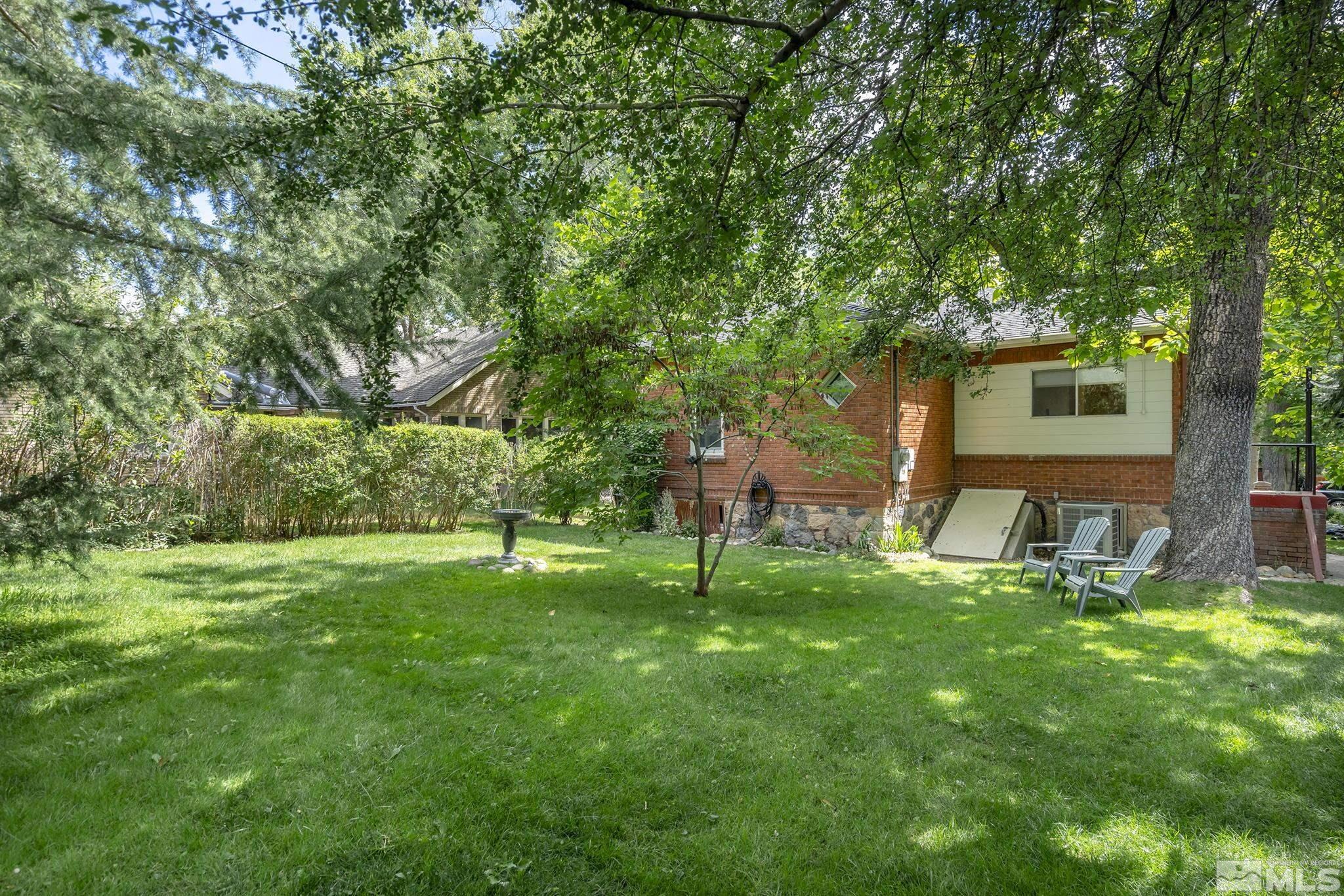 1015 Forest Street Reno, NV 89509 - Photo 21 of 22 a backyard of a house with table and chairs