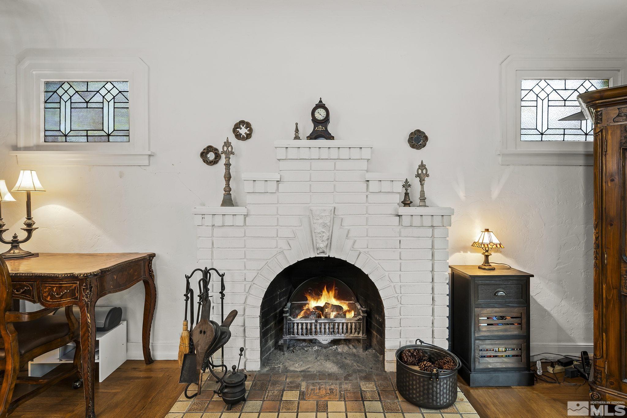 1015 Forest Street Reno, NV 89509 - Photo 7 of 22 a living room with furniture a fireplace and a fireplace