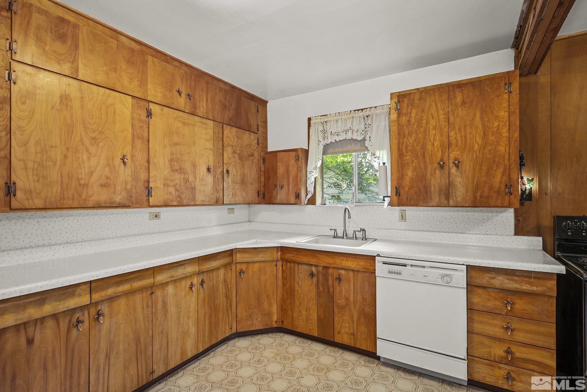 1015 Forest Street Reno, NV 89509 - Photo 10 of 22 a kitchen with a sink cabinets and window