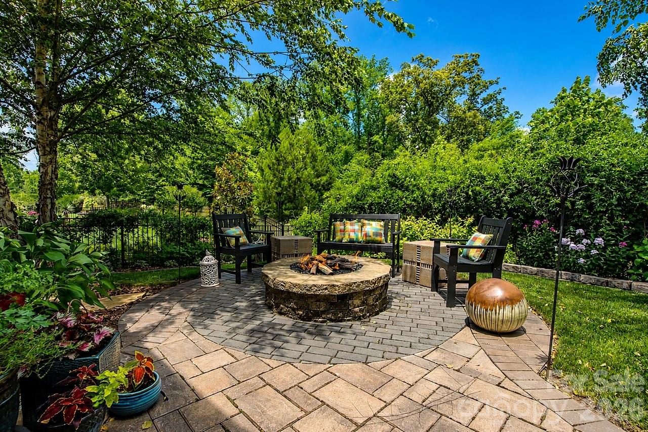 4854 Looking Glass Trail Denver, NC 28037 - Photo 27 of 48 a backyard of a house with fire pit and outdoor seating