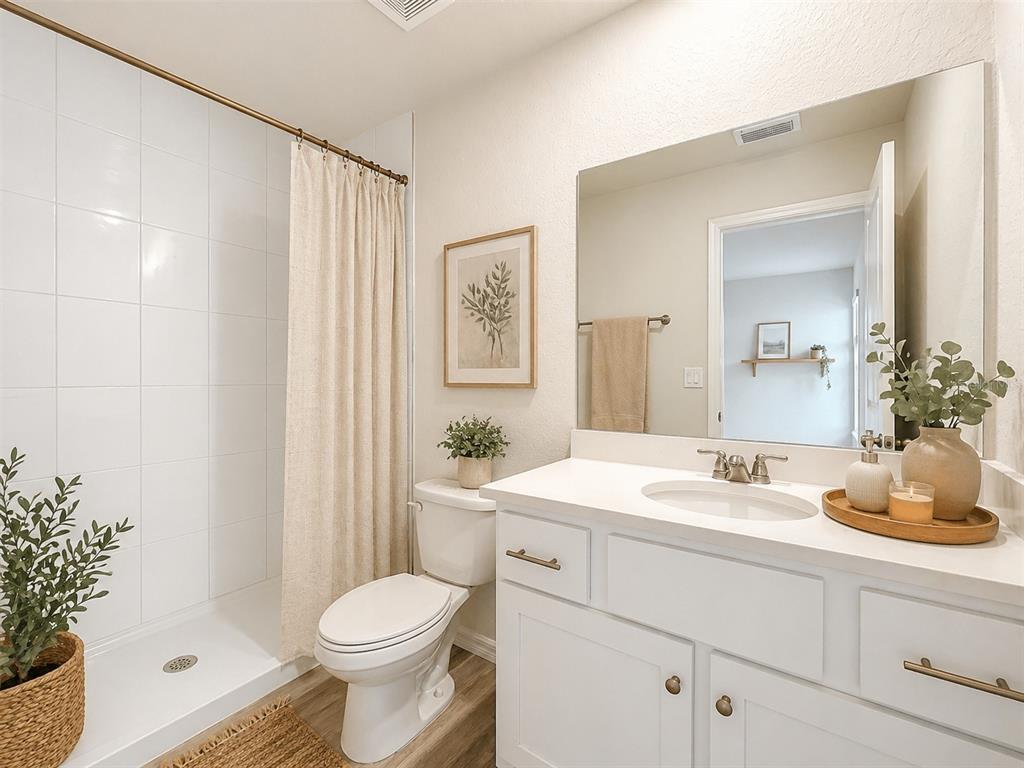 111 East Harvard Street Inverness, FL 34452 - Photo 11 of 21 a bathroom with a sink toilet and shower