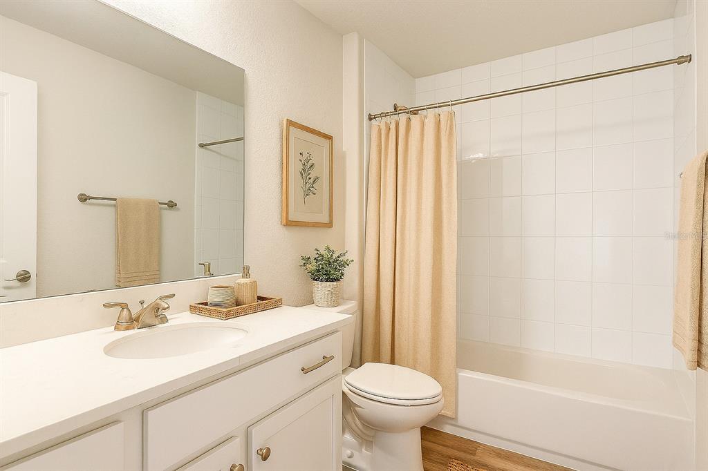 111 East Harvard Street Inverness, FL 34452 - Photo 16 of 21 a bathroom with a sink toilet and shower