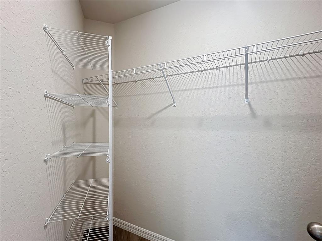 111 East Harvard Street Inverness, FL 34452 - Photo 18 of 21 a view of a room with racks on the wall