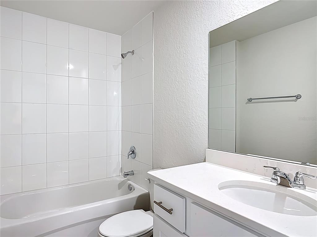 111 East Harvard Street Inverness, FL 34452 - Photo 20 of 21 a bathroom with a sink toilet and shower