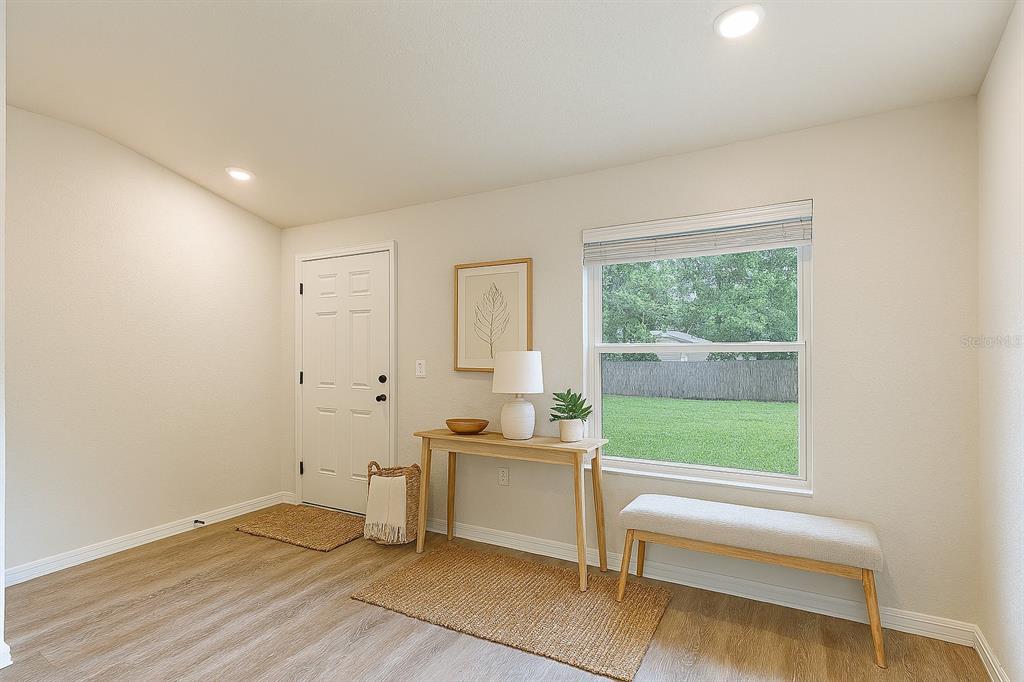 111 East Harvard Street Inverness, FL 34452 - Photo 2 of 21 a view of an empty room with a window