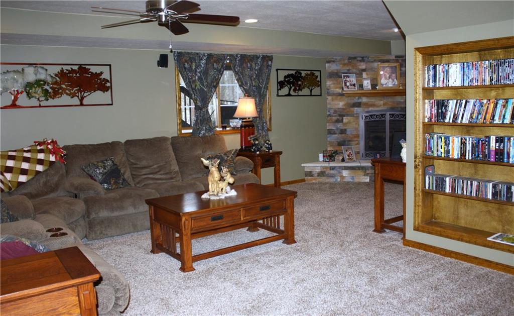 157 Robinson Run Road Butler, PA 16002 - Photo 17 of 24 Large Game Room with Log burning fireplace and built in bookcase.