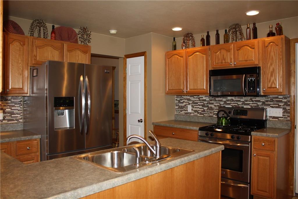 157 Robinson Run Road Butler, PA 16002 - Photo 6 of 24 Kitchen with stainless steel appliances and nice backsplash